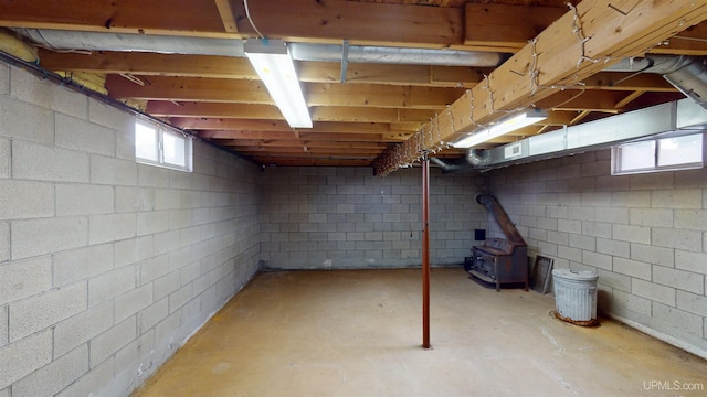 730 Elliott Ave, Ishpeming, MI 49855 - below grade area featuring a wood stove