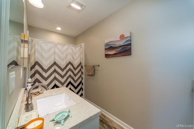 106 Green Rd, Michigamme, MI 49861 - full bath with vanity, baseboards, wood finished floors, and a shower with curtain