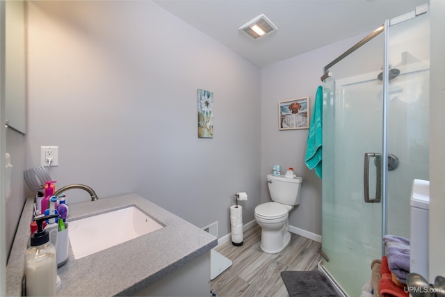 106 Green Rd, Michigamme, MI 49861 - bathroom with toilet, a stall shower, wood finished floors, and baseboards