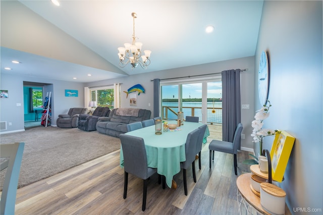 106 Green Rd, Michigamme, MI 49861 - dining room with a chandelier, vaulted ceiling, recessed lighting, wood finished floors, and baseboards