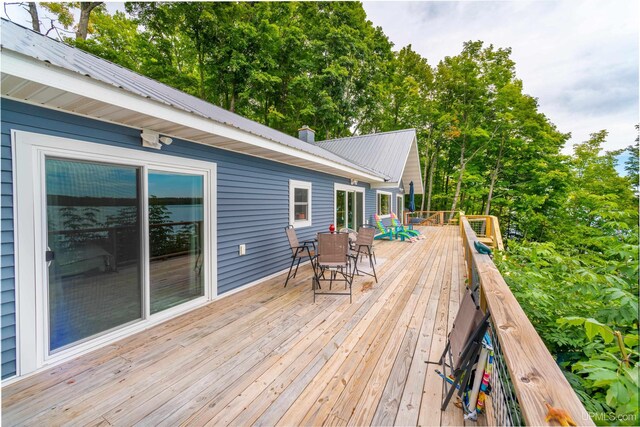106 Green Rd, Michigamme, MI 49861 - wooden deck featuring outdoor dining area