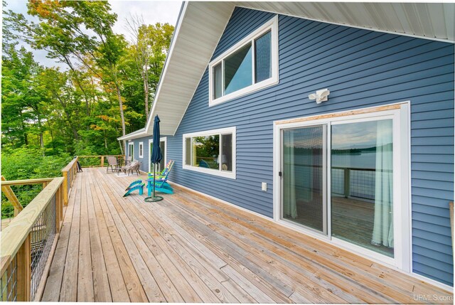 106 Green Rd, Michigamme, MI 49861 - wooden deck featuring outdoor dining space