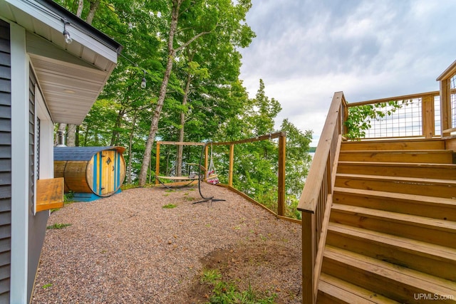 106 Green Rd, Michigamme, MI 49861 - view of yard featuring stairway, a playground, a storage shed, and an outdoor structure