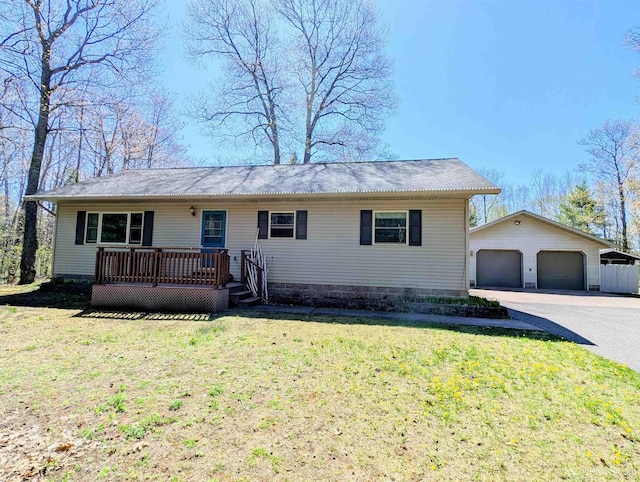 14 Arrowhead Dr, Marquette, MI 49855 - ranch-style house with a garage, an outdoor structure, a front yard, and a deck