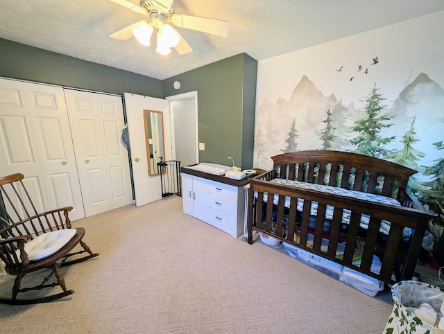 14 Arrowhead Dr, Marquette, MI 49855 - bedroom featuring light colored carpet, a closet, ceiling fan, and a textured ceiling