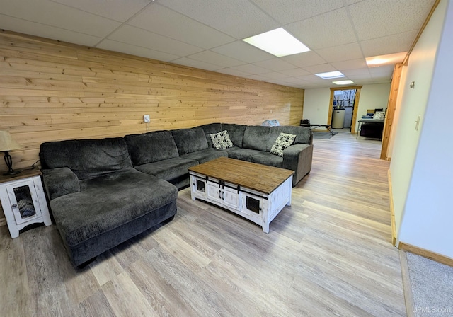 14 Arrowhead Dr, Marquette, MI 49855 - living area with wood walls, a drop ceiling, and light wood-style flooring
