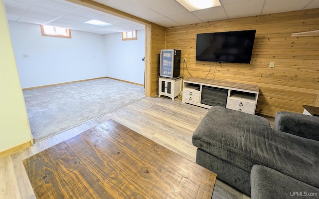 14 Arrowhead Dr, Marquette, MI 49855 - living area with baseboards, wooden walls, a paneled ceiling, and wood finished floors