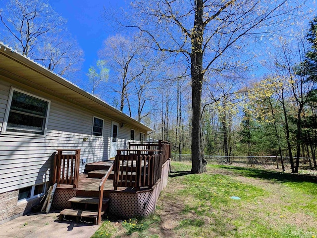 14 Arrowhead Dr, Marquette, MI 49855 - view of yard featuring a wooden deck and fence