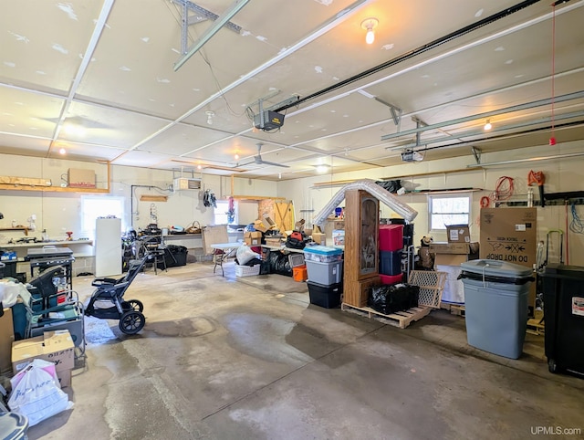 14 Arrowhead Dr, Marquette, MI 49855 - garage with a garage door opener and a workshop area