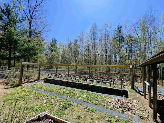 14 Arrowhead Dr, Marquette, MI 49855 - view of yard with a garden and fence