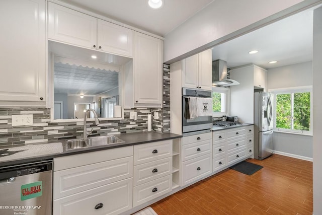 1131 Boyd St, Troy, MI 48083 - kitchen featuring appliances with stainless steel finishes, a sink, backsplash, wall chimney range hood, and recessed lighting
