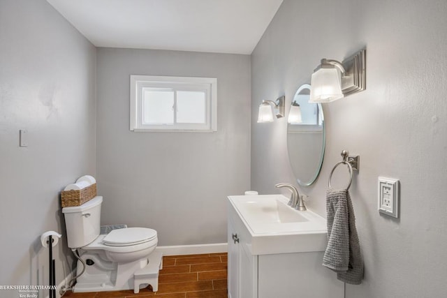 1131 Boyd St, Troy, MI 48083 - half bathroom with wood tiled floors, plenty of natural light, toilet, and vanity