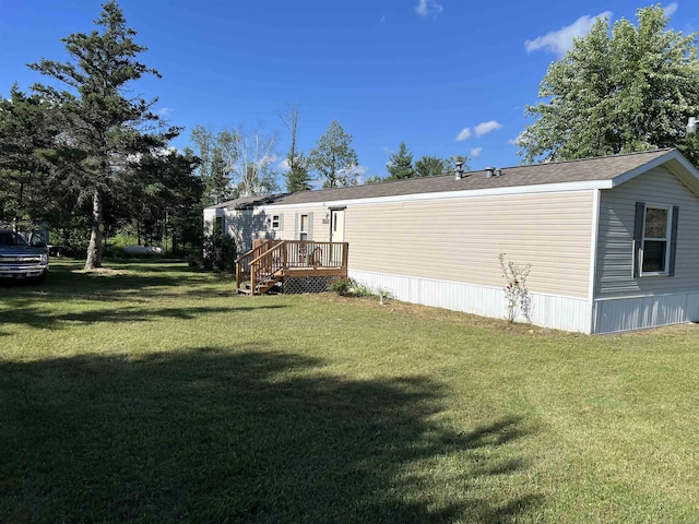 3065 S Curtisville Rd, South Branch, MI 48761 - view of green lawn with a deck