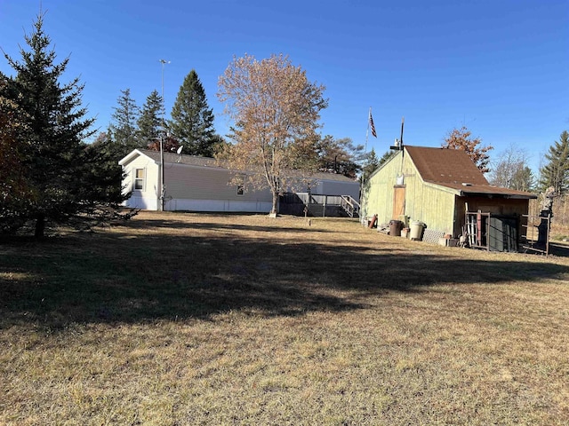 3065 S Curtisville Rd, South Branch, MI 48761 - view of green lawn featuring an outdoor structure