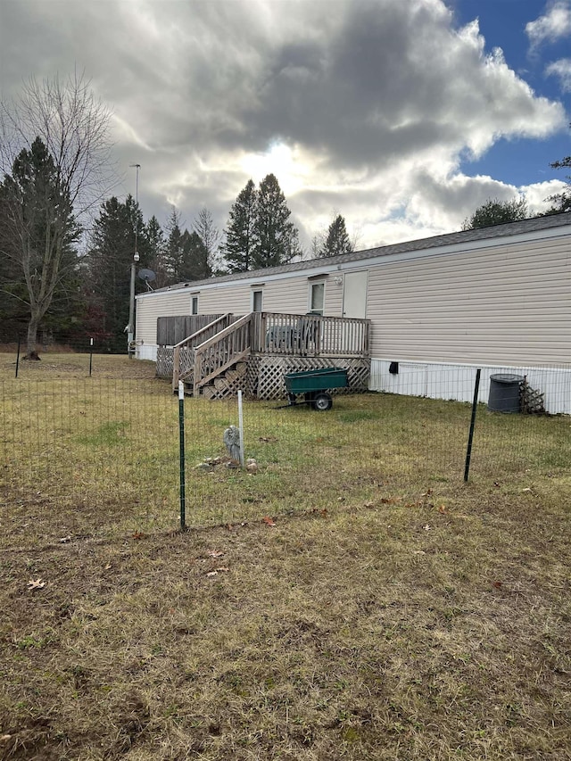 3065 S Curtisville Rd, South Branch, MI 48761 - view of grassy yard featuring a wooden deck