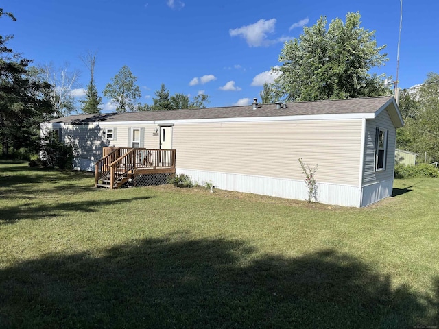 3065 S Curtisville Rd, South Branch, MI 48761 - rear view of property featuring a yard and a deck