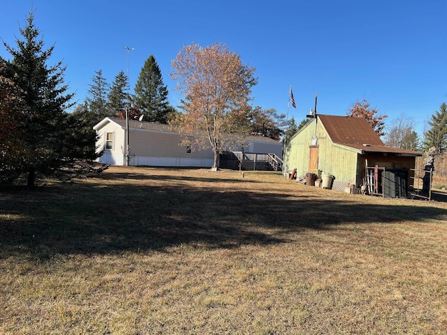 3065 S Curtisville Rd, South Branch, MI 48761 - view of green lawn with an outdoor structure