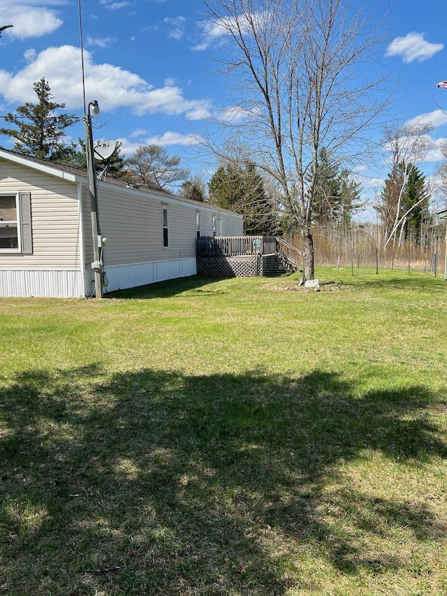3065 S Curtisville Rd, South Branch, MI 48761 - view of grassy yard with a deck