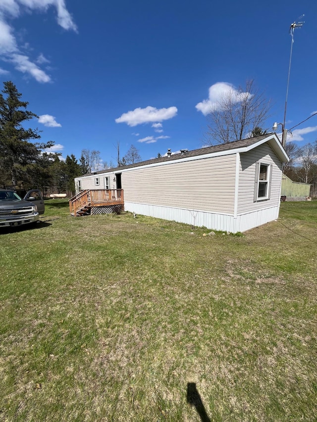 3065 S Curtisville Rd, South Branch, MI 48761 - view of green lawn featuring a deck