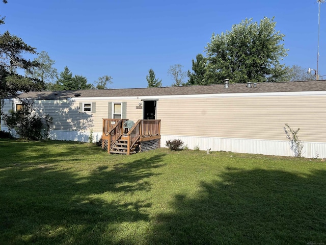 3065 S Curtisville Rd, South Branch, MI 48761 - rear view of house featuring a lawn