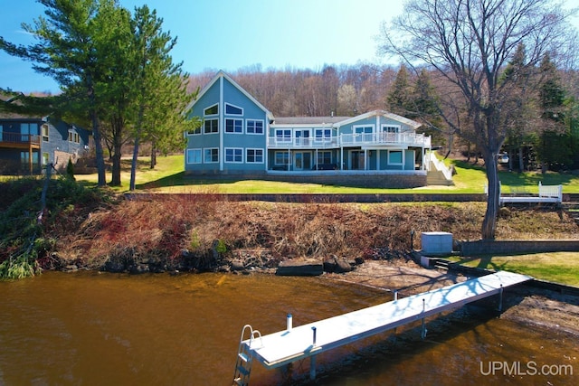 18918 Canal Rd, Houghton, MI 49931 - rear view of property featuring a lawn and a water view