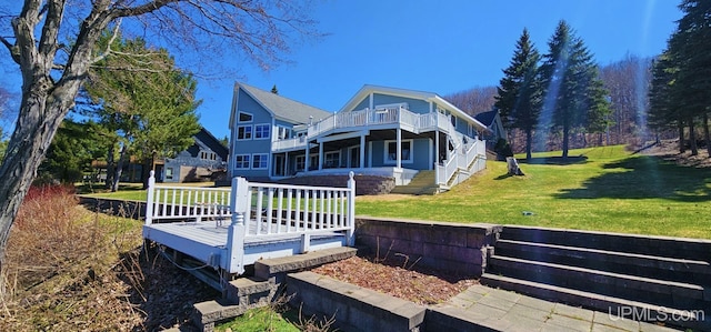 18918 Canal Rd, Houghton, MI 49931 - rear view of house featuring a deck and a lawn