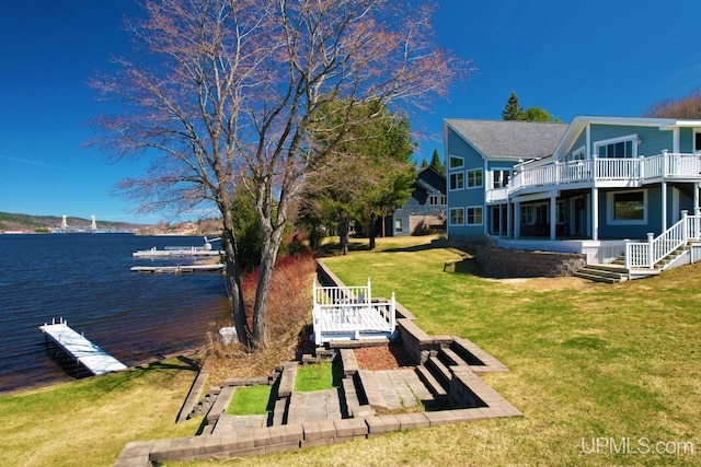 18918 Canal Rd, Houghton, MI 49931 - view of green lawn featuring a patio and a deck with water view