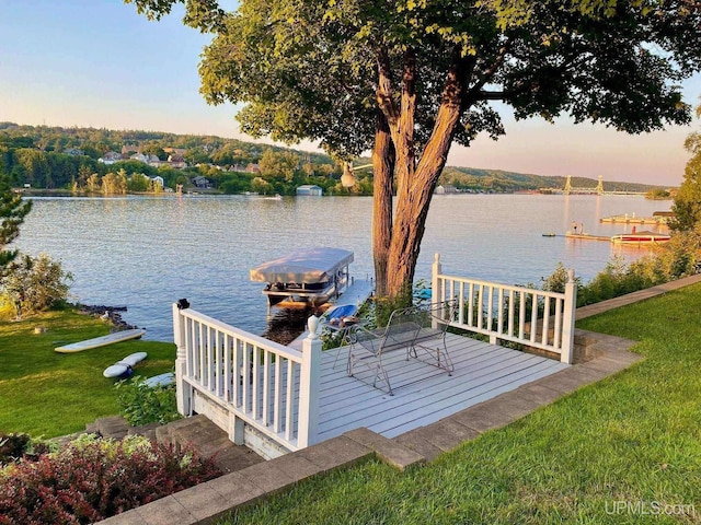 18918 Canal Rd, Houghton, MI 49931 - dock featuring boat lift, a water view, and a lawn