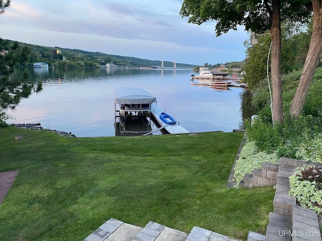 18918 Canal Rd, Houghton, MI 49931 - dock area featuring a water view and a lawn