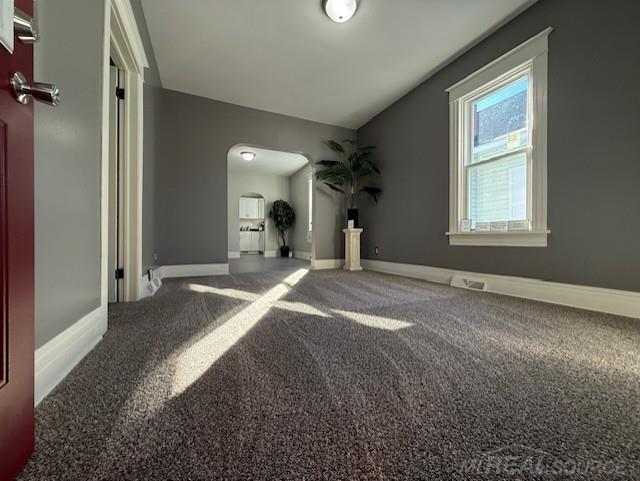 1416 Kearney St, Port Huron, MI 48060 - carpeted spare room with arched walkways and baseboards
