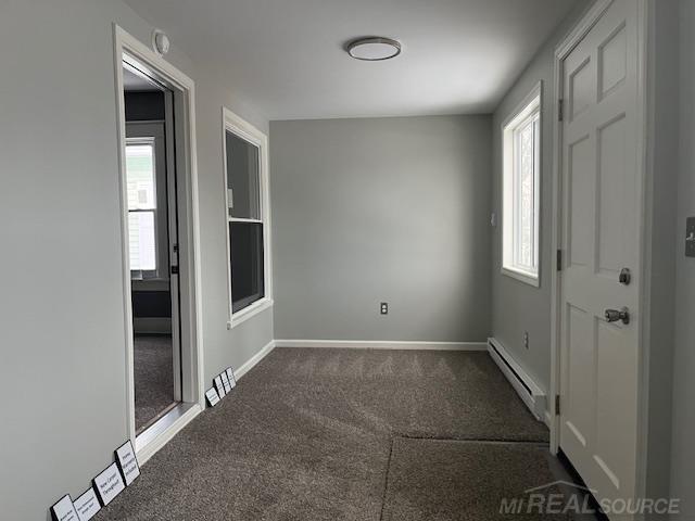 1416 Kearney St, Port Huron, MI 48060 - carpeted empty room with a baseboard radiator and baseboards