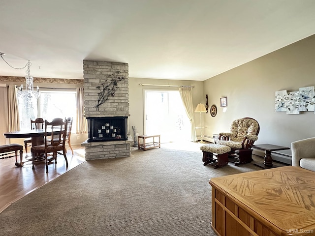 9014 Stagecoach Q.5 Ave, Gladstone, MI 49837 - living room with plenty of natural light, a fireplace, and a baseboard heating unit