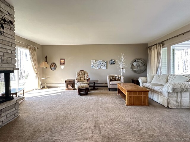 9014 Stagecoach Q.5 Ave, Gladstone, MI 49837 - living area featuring carpet floors, a baseboard heating unit, and a baseboard radiator