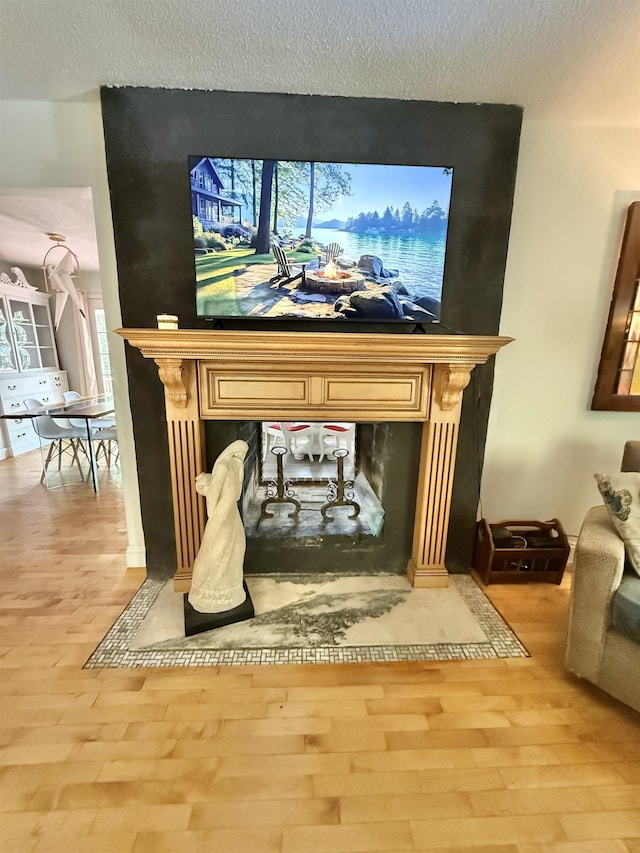 555 W Saxton Rd, Sanford, MI 48657 - detailed view of wood finished floors and a textured ceiling
