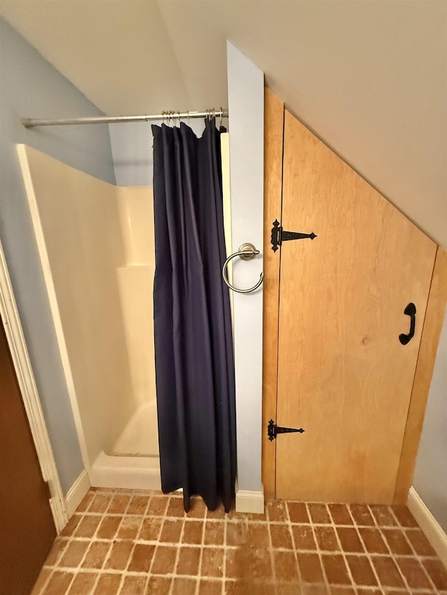 555 W Saxton Rd, Sanford, MI 48657 - bathroom with a shower stall and baseboards