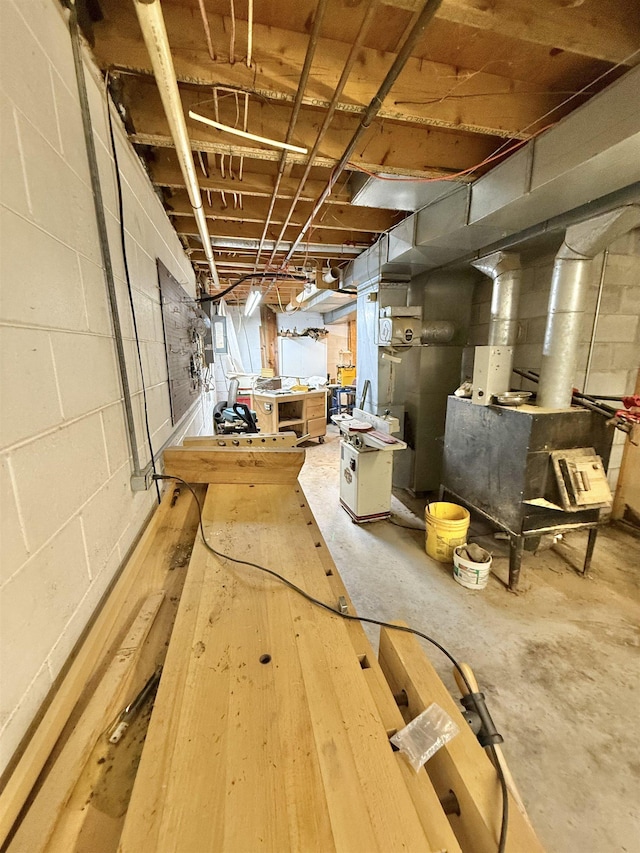 555 W Saxton Rd, Sanford, MI 48657 - unfinished below grade area with a workshop area