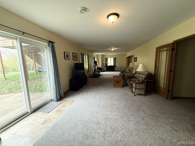 1300 W Sharon Ave, Houghton, MI 49931 - living room with healthy amount of natural light and light carpet