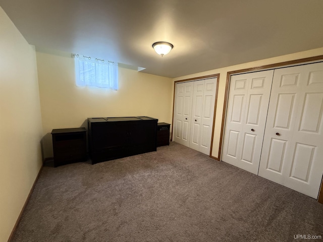 1300 W Sharon Ave, Houghton, MI 49931 - carpeted bedroom featuring two closets