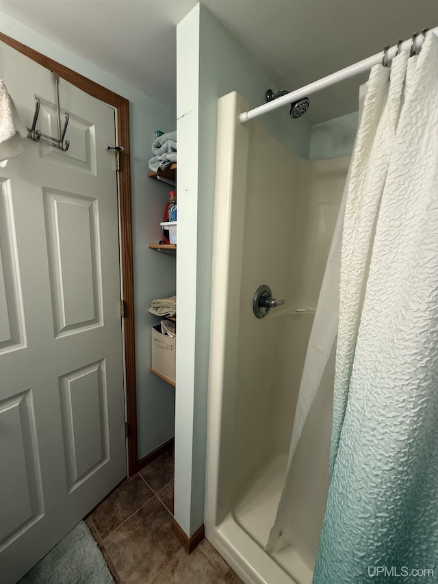 1300 W Sharon Ave, Houghton, MI 49931 - bathroom featuring a shower stall and tile patterned floors