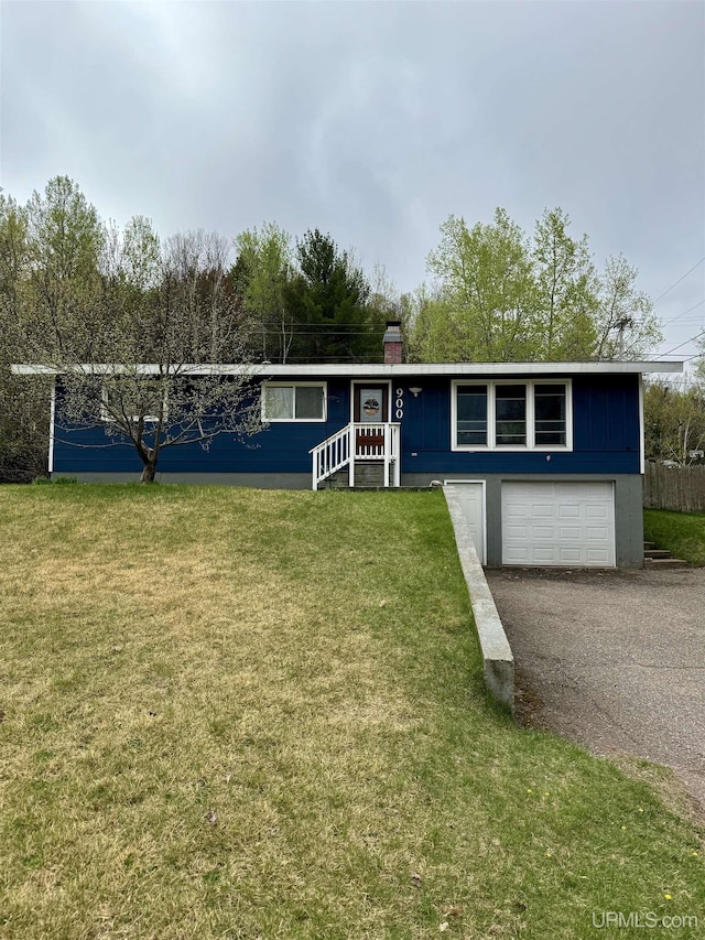 900 Wabash St, Ishpeming, MI 49849 - ranch-style home with driveway, a front yard, and a garage