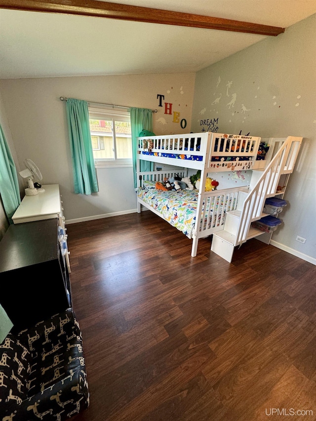 900 Wabash St, Ishpeming, MI 49849 - bedroom with wood finished floors, baseboards, and beam ceiling