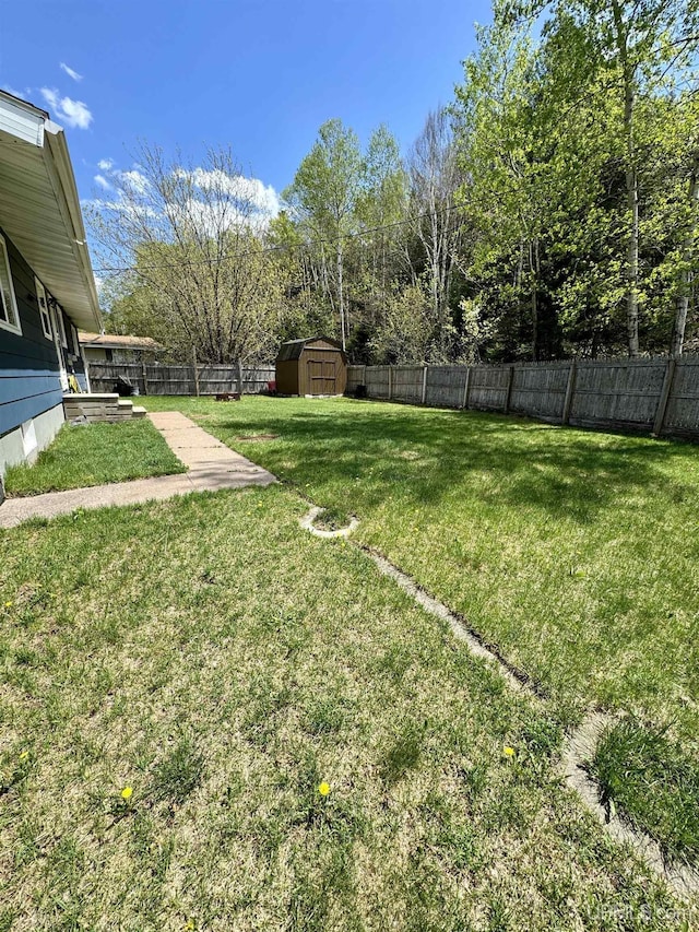 900 Wabash St, Ishpeming, MI 49849 - view of yard with a storage unit and an outdoor structure