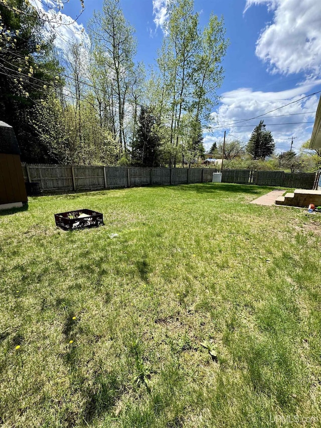 900 Wabash St, Ishpeming, MI 49849 - view of yard with a fire pit