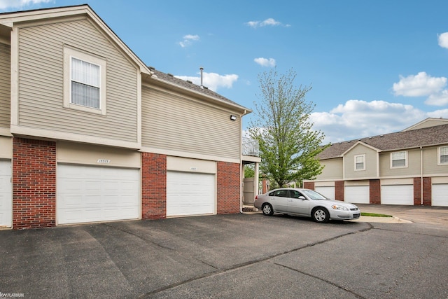 view of property exterior with brick siding