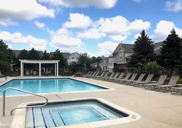 community pool with a pergola, a patio area, fence, and a community hot tub