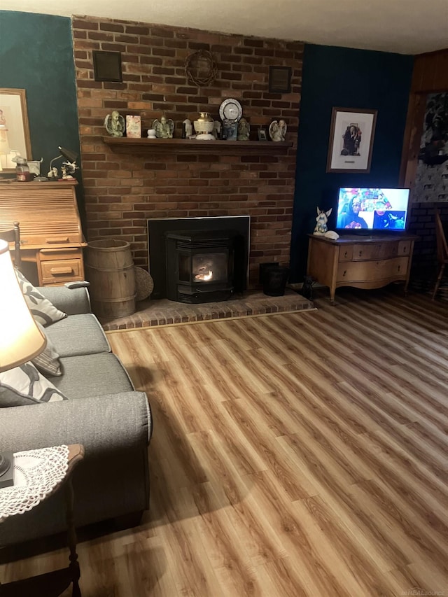 63150 Mound Rd, Washington Twp, MI 48095 - living room featuring a brick fireplace and wood finished floors