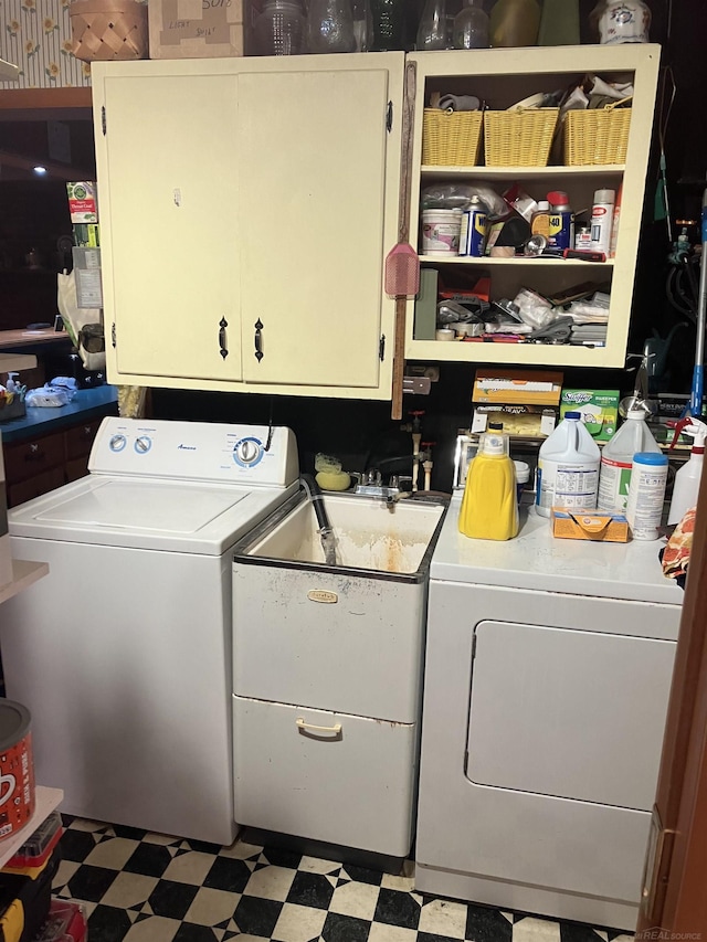 63150 Mound Rd, Washington Twp, MI 48095 - washroom with washer and dryer, cabinet space, and tile patterned floors