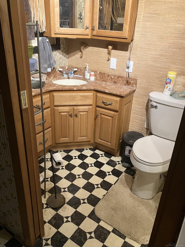 63150 Mound Rd, Washington Twp, MI 48095 - half bath with tile patterned floors, toilet, and vanity