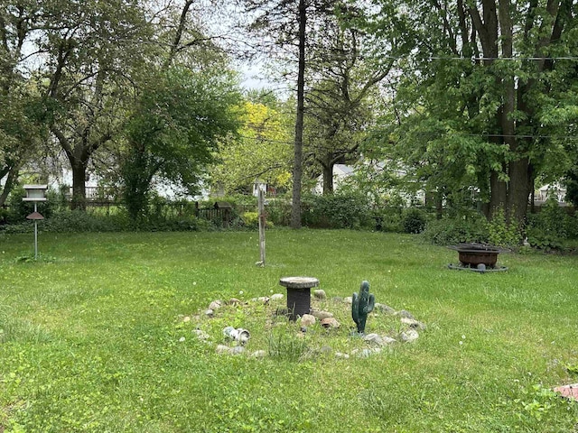 63150 Mound Rd, Washington Twp, MI 48095 - view of yard featuring an outdoor fire pit