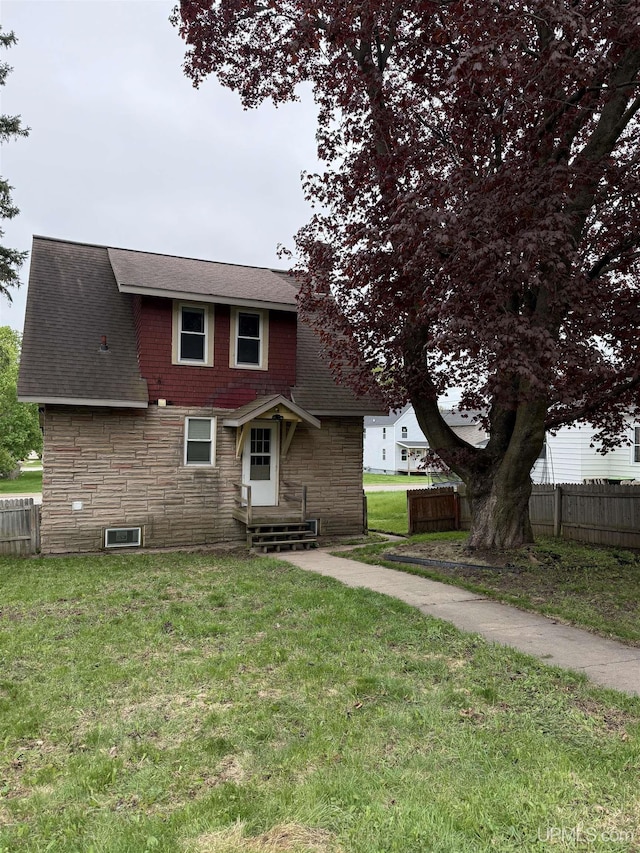 404 W Ludington St, Iron Mountain, MI 49801 - view of front of house with stone siding and roof with shingles